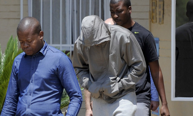 Oscar Pistorius leaving Boshkop police station