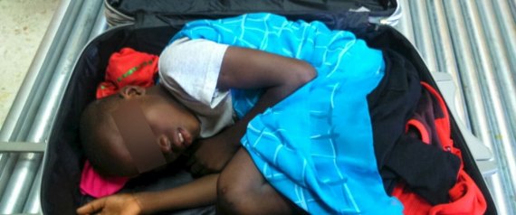 ATTENTION EDITORS: SPANISH LAW REQUIRES THAT THE FACES OF MINORS ARE MASKED IN PUBLICATIONS WITHIN SPAIN  An eight-year-old boy is seen cramped inside a suitcase on a Spanish civil guard  border security check point between Morocco and Spain's north african enclave Ceuta, Spain in this handout photo released May 8, 2015. A 19-year-old woman was arrested May 7, 2015 for the attempted smuggling of the boy, who was checked by medics and handed over to juvenile prosecutors office, according to authorities. Picture taken May 7, 2015. Eyes masked at source. REUTERS/MINISTERIO DEL INTERIOR/Handout via Reuters     ATTENTION EDITORS - THIS PICTURE WAS PROVIDED BY A THIRD PARTY. REUTERS IS UNABLE TO INDEPENDENTLY VERIFY THE AUTHENTICITY, CONTENT, LOCATION OR DATE OF THIS IMAGE. NO SALES. NO ARCHIVES. FOR EDITORIAL USE ONLY. NOT FOR SALE FOR MARKETING OR ADVERTISING CAMPAIGNS. THIS PICTURE IS DISTRIBUTED EXACTLY AS RECEIVED BY REUTERS, AS A SERVICE TO CLIENTS. NO COMMERCIAL USE.