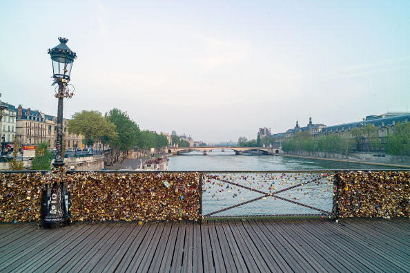 PARIS, FRANCE - MAY 07:  Love Padlocks on the Le Pont Des Arts bridge on May 7, 2014 in Paris, France. In recent years Le Pont Des Arts has attracted tourists who visit the bridge to attach padlocks to the railing or the gate with their names written or engraved on the padlock, and then throw the key into the river Seine as a romantic gesture. The accumulation of the 'love locks', a phenomenon popular in many European cities is starting to pose safety concerns, due to their mass weight.  (Photo by Pierre Suu/Getty Images)